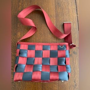Harvey’s seatbelt bag. Red & blue checkered with red strap.